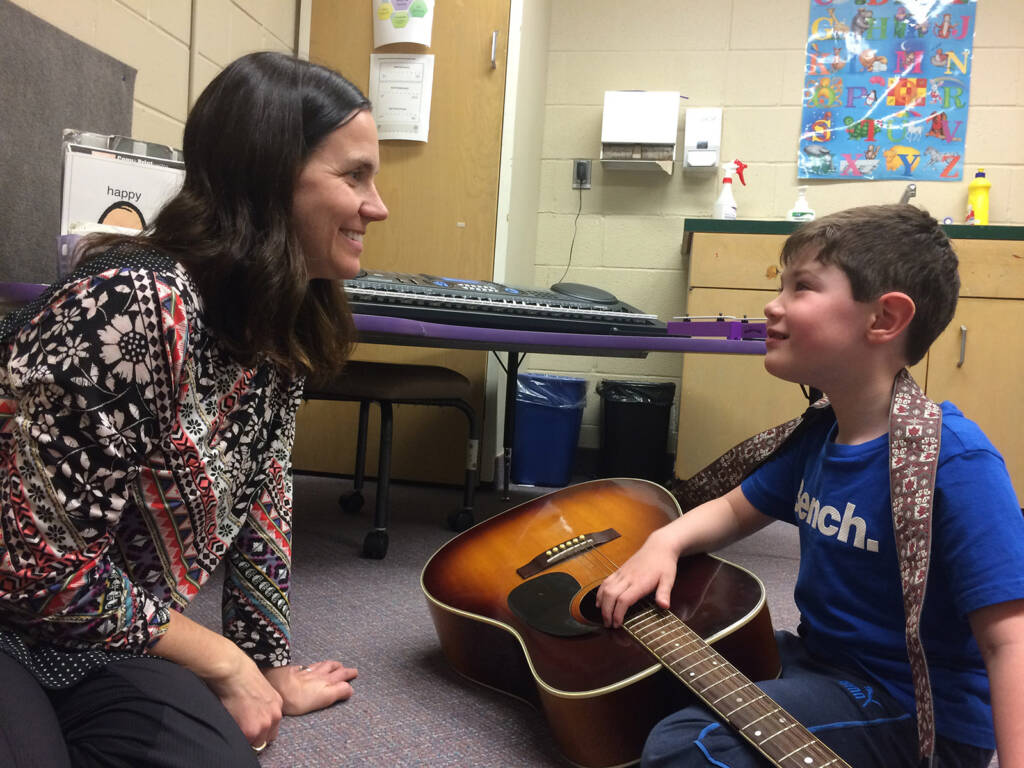 Logan, 5, enjoys a music therapy session with Melissa Hope at Five Counties Children's Centre