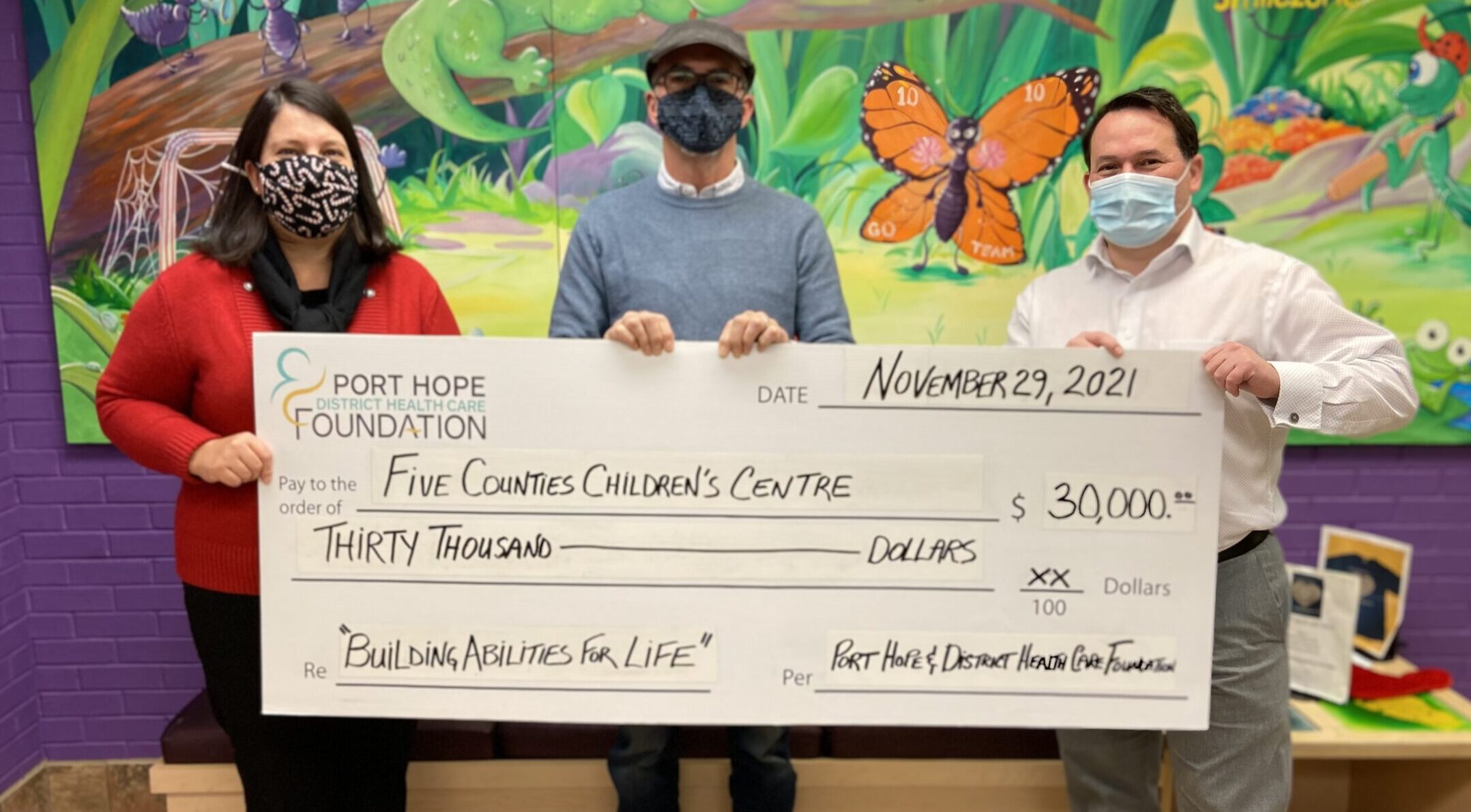Lyn Giles, FCCC Director Fund Development; Matt Clayton, President of the Port Hope and District Healthcare Foundation; Scott Pepin. FCCC CEO holding a large cheque made payable to Five Counties Children's Centre for $30, 000.
