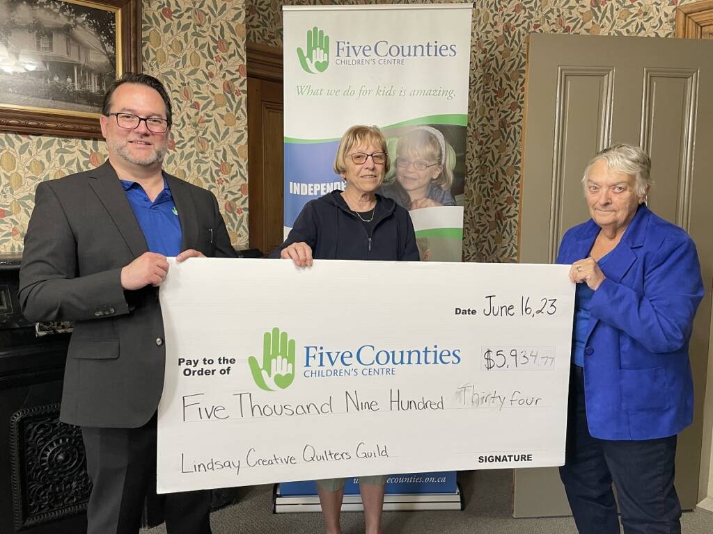 Members of Lindsay Creative Quilters Guild present a cheque for nearly $6,000