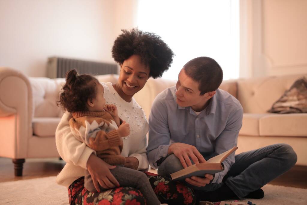 Parents read with a child