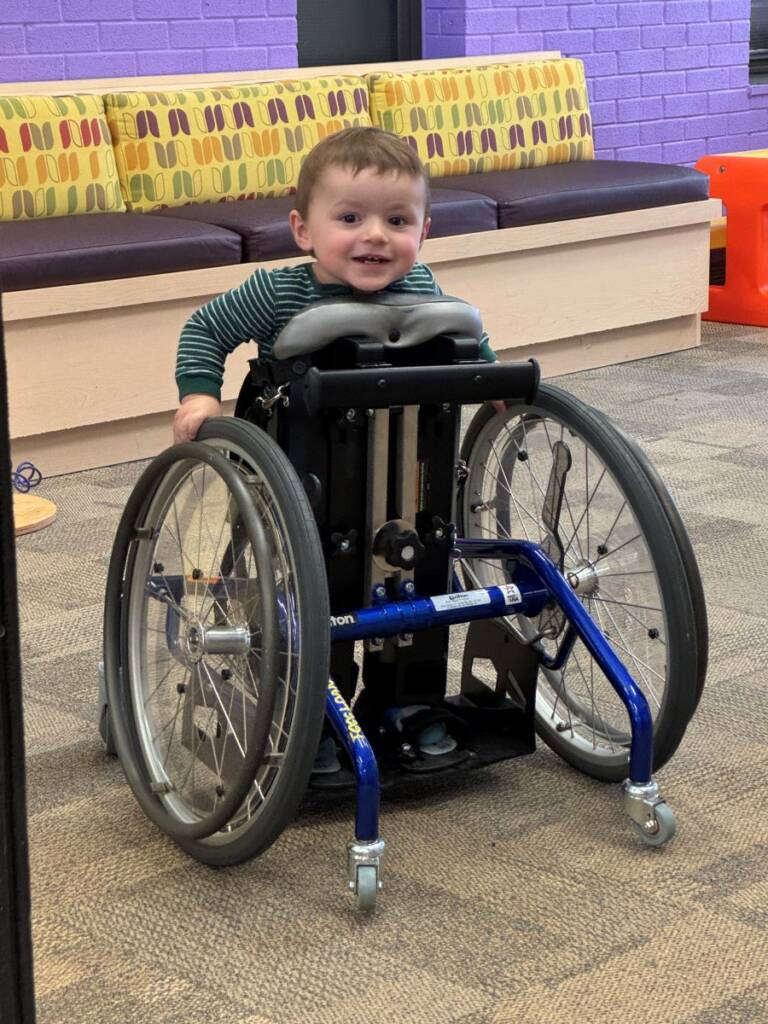 Arthur in his stand-up wheelchair at Five Counties.