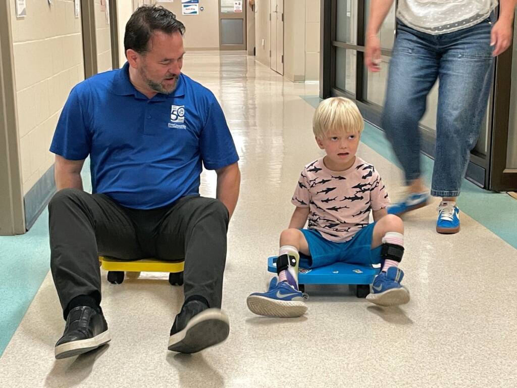 Scott and Hamish CEO Scott races client Hamish down the hall
